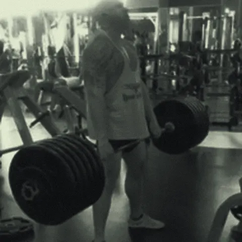 Boyd Myers deadlifting a heavily loaded barbell
